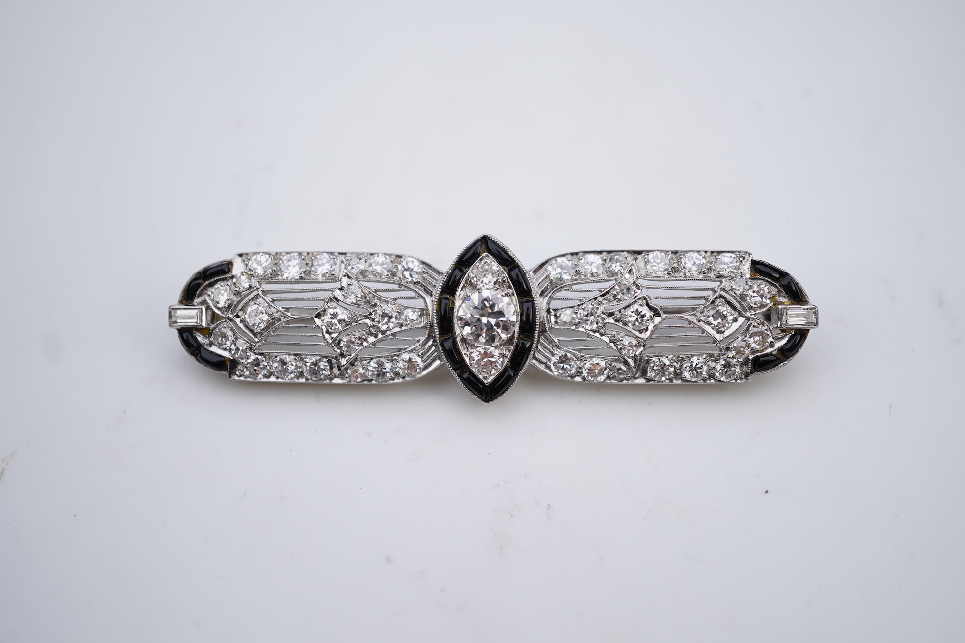An Art Deco onyx and diamond brooch, 1920s